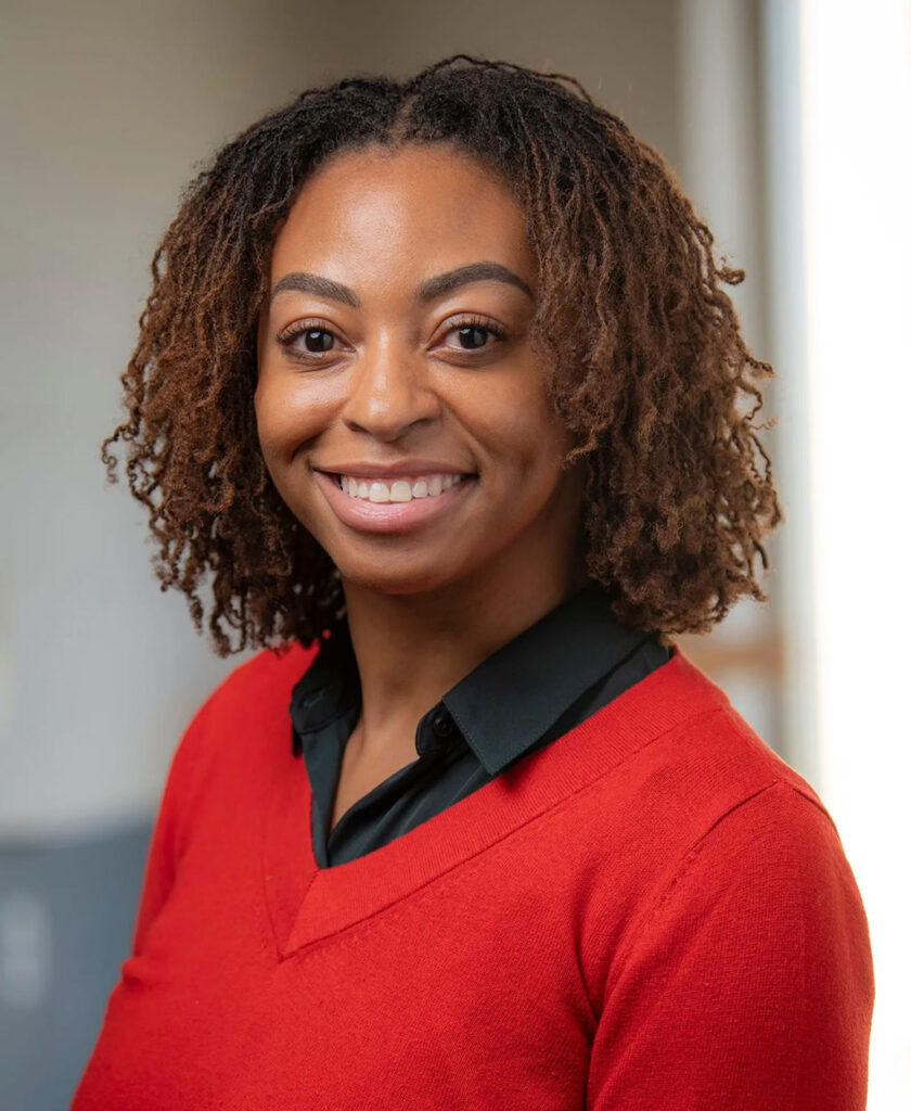 zuri wearing a red polo headshot